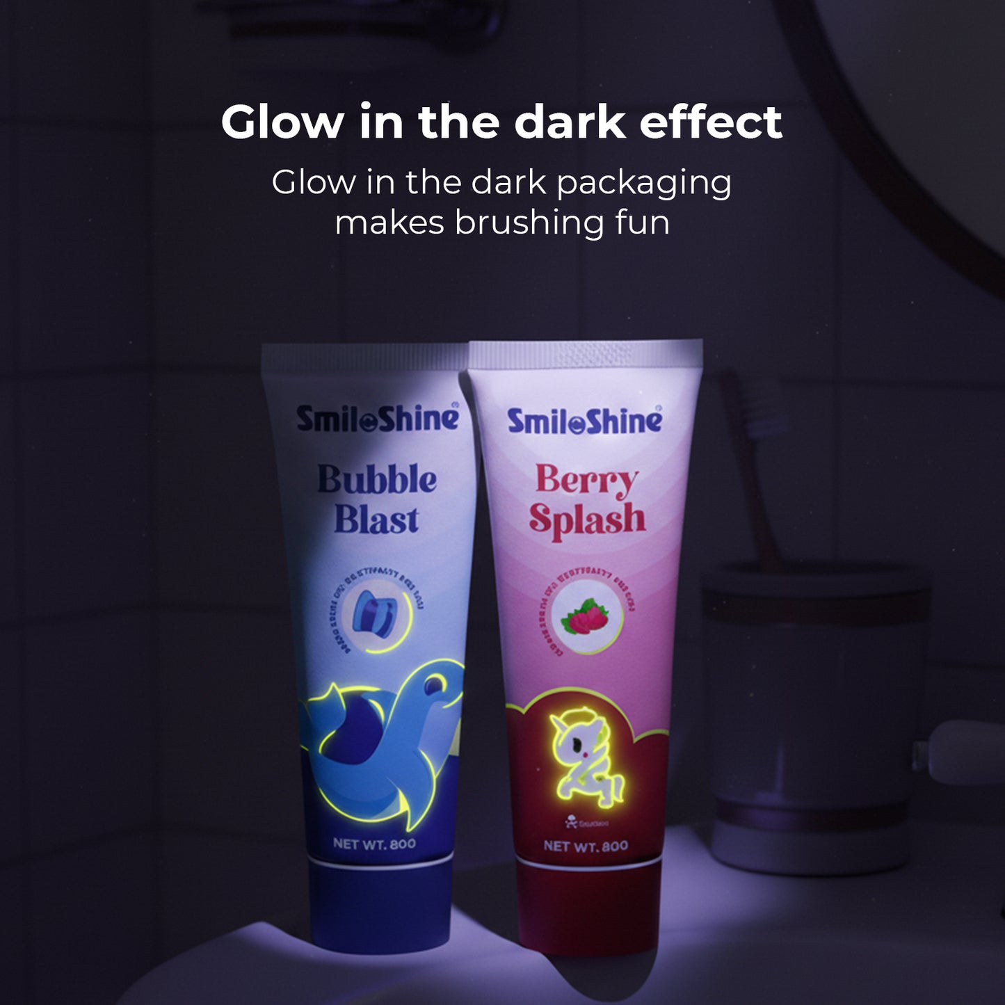 Dark background showing SmiloShine toothpaste tubes glowing in the dark, demonstrating the fun night-time brushing experience for kids.