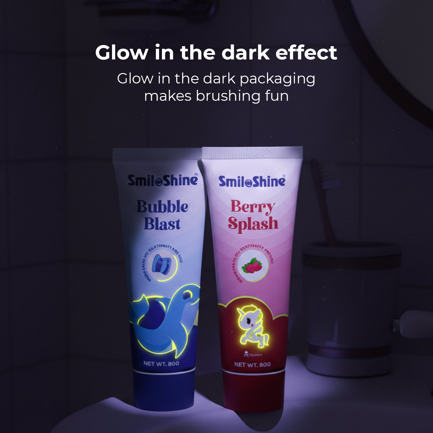 Dark background showing SmiloShine toothpaste tubes glowing in the dark, demonstrating the fun night-time brushing experience for kids.