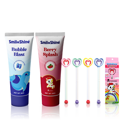 SmiloShine Kids Complete Hygiene Set featuring Berry and Bubble Glow Toothpastes and a Unicorn Heartipop Tongue Cleaner.