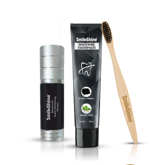 SmiloShine Signature Teeth Whitening Ritual 3-in-1 combo kit featuring Activated Charcoal Toothpaste, Advance Whitening Serum, and Bamboo Toothbrush on a white background.